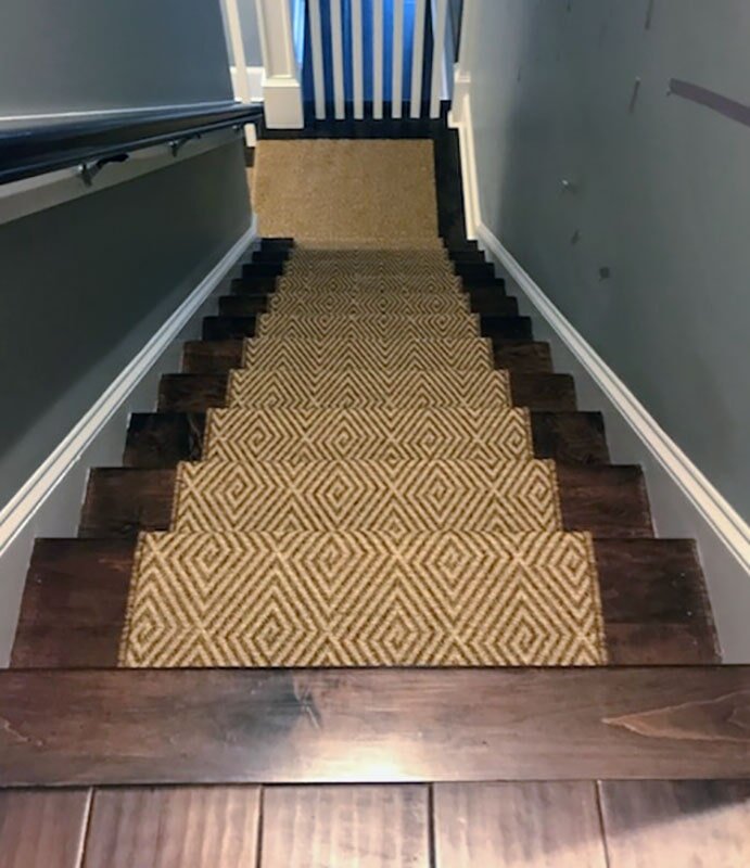 Hardwood stairs with stair runner in Cary, NC from Bell's Carpets & Floors